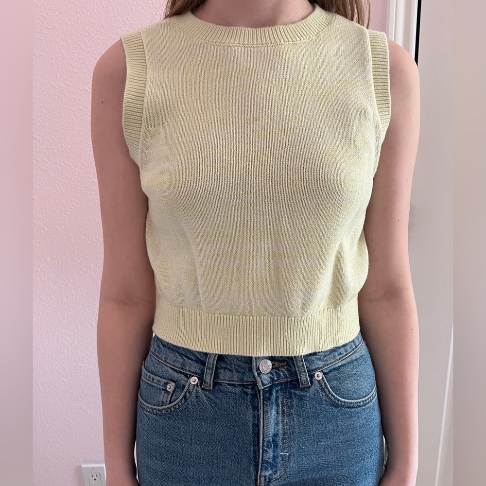yellow sweater vest